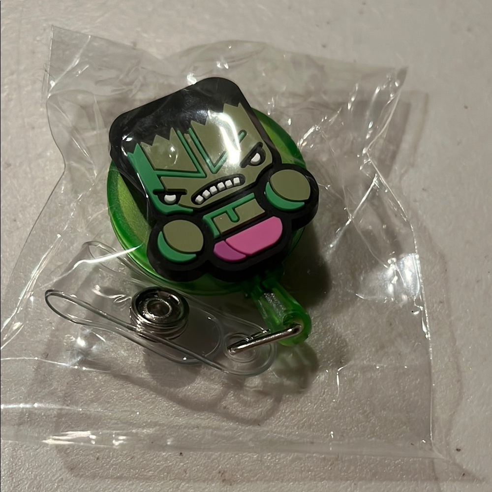 Green Character Phone Accessory. The hulk badge holder